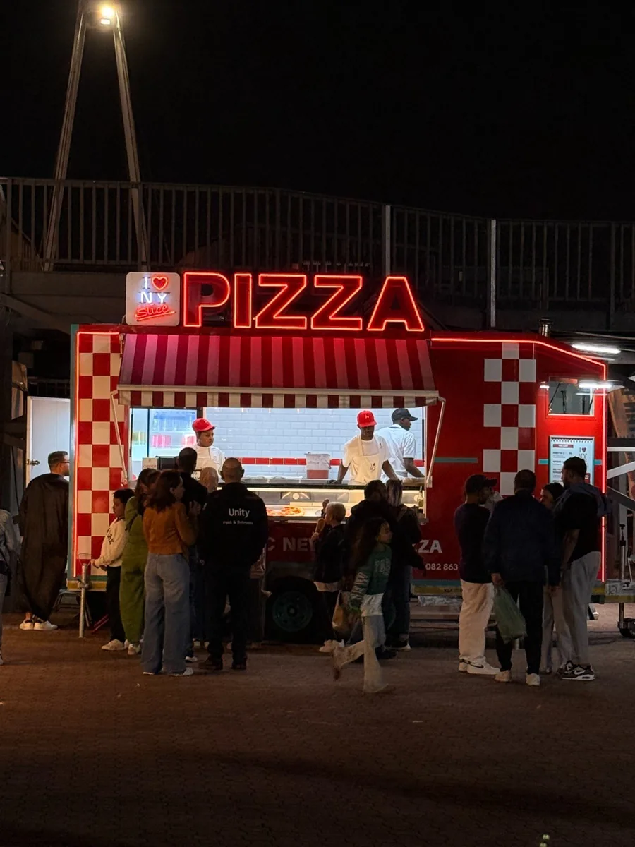 The NY Slice trailer lit up at night