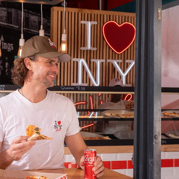Eating a slice at the NY Slice counter