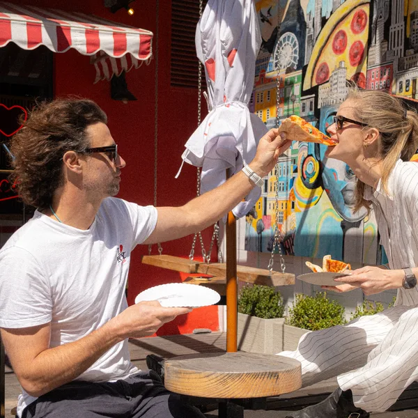 Friends sharing slices at a NY Slice event