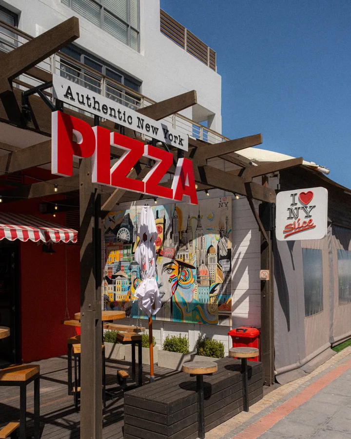 NY Slice Big Bay, with its pizza sign and pergola