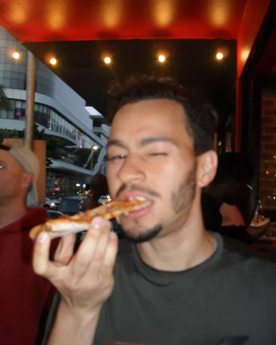 A runner biting into a slice