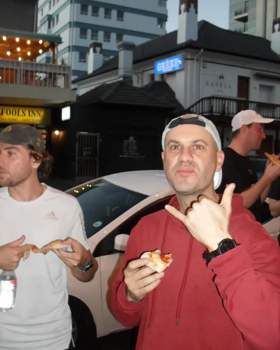 A runner throwing a shaka with his slice