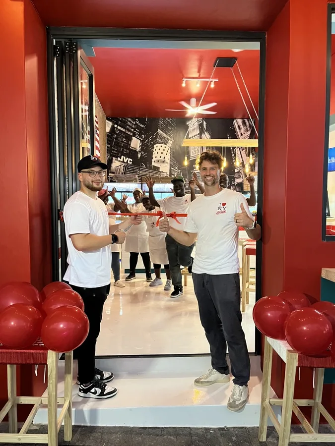 Mark and Adam cutting the ribbon at NY Slice Florida Road, Durban